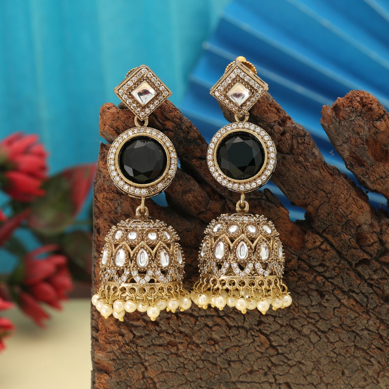Antique gold statement jhumka earrings featuring square diamond-shaped Kundan studs, circular jet black Monalisa stones, and pearl-edged dome drops.